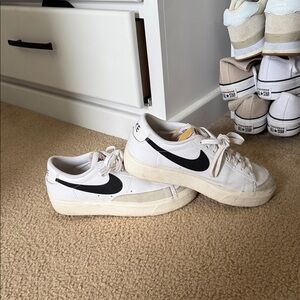 Nike White Low-Top Sneakers with Black Swoosh